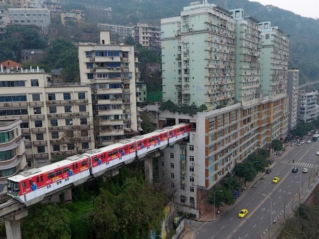 A train running through a building in Chongqing