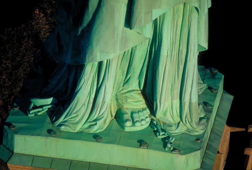 The broken chain at the feet of the Statue of Liberty