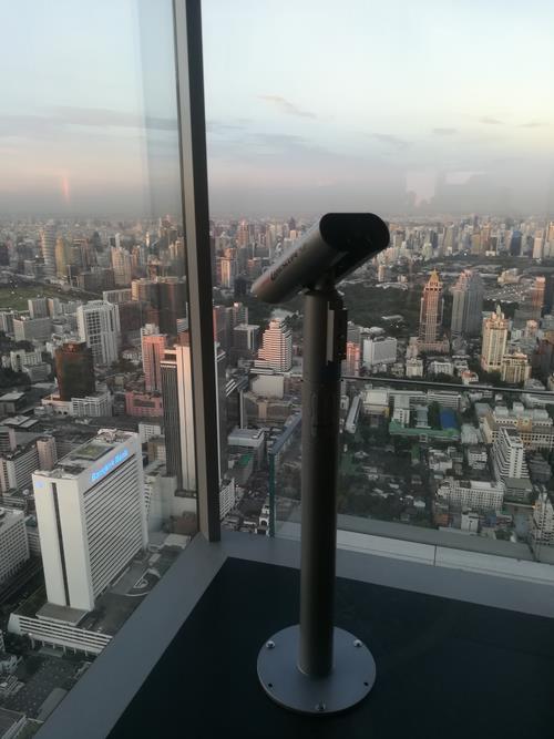 A telescope at a corner of the observation deck
